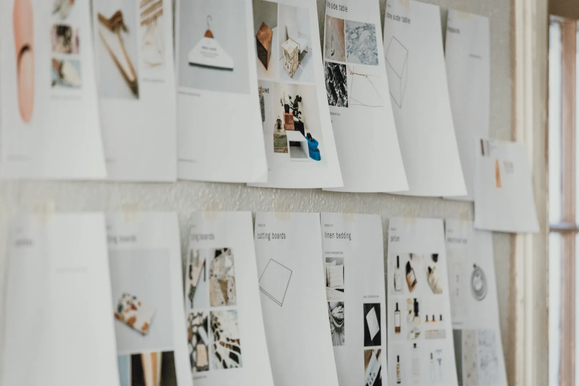 CPG product development boards pinned to a studio wall.